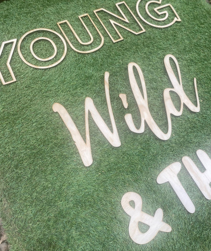 Young Wild and Three Wooden Backdrop Letters / Display